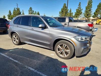 Czwarte zdjęcie samochodu z boku: 2014 BMW X5 SDRIVE35I VIN:5UXKR2C52E0H32480 - miniatura