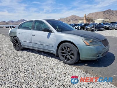 Czwarte zdjęcie samochodu z boku: 2002 NISSAN ALTIMA 3.5 SE VIN:1N4BL11D12C107198 - miniatura