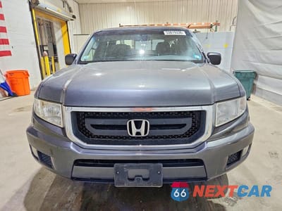 Piąte zdjęcie samochodu w środku: 2011 HONDA RIDGELINE RT VIN:5FPYK1F29BB453220 - miniatura