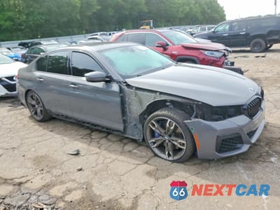 Czwarte zdjęcie samochodu z boku: 2021 BMW M550XI VIN:WBA13BK03MCF11162 - miniatura
