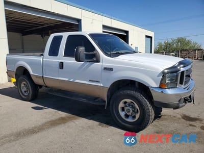 Czwarte zdjęcie samochodu z boku: 1999 FORD F250 SUPER DUTY VIN:1FTNX21F3XEC30760 - miniatura
