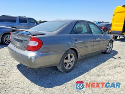 Trzecie zdjęcie samochodu z tyłu: 2002 TOYOTA CAMRY SE V6 VIN:JTDBF30K420010723 - miniatura