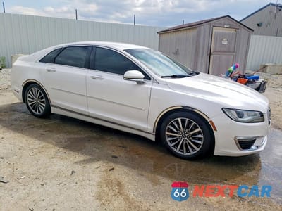 Czwarte zdjęcie samochodu z boku: 2017 LINCOLN MKZ PREMIERE VIN:3LN6L5A95HR614139 - miniatura
