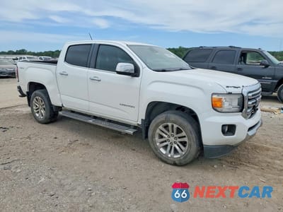 Czwarte zdjęcie samochodu z boku: 2015 GMC CANYON SLT VIN:1GTG6CE31F1155516 - miniatura