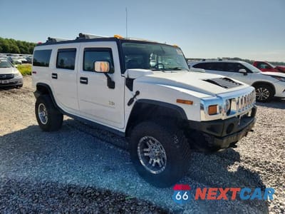 Czwarte zdjęcie samochodu z boku: 2004 HUMMER H2 VIN:5GRGN23U44H122571 - miniatura