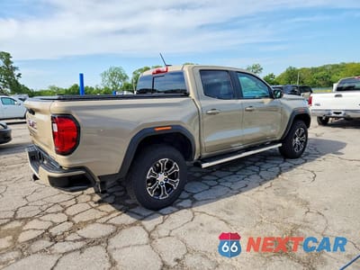 Trzecie zdjęcie samochodu z tyłu: 2023 GMC CANYON AT4 VIN:1GTP6DEK7P1143501 - miniatura