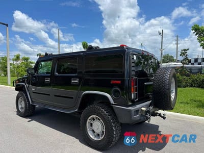 Trzecie zdjęcie samochodu z tyłu: 2003 HUMMER H2 VIN:5GRGN23U03H119486 - miniatura