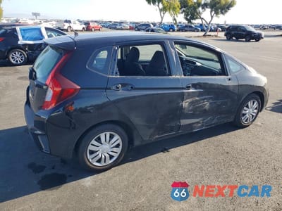 Trzecie zdjęcie samochodu z tyłu: 2016 HONDA FIT LX VIN:JHMGK5H50GX000246 - miniatura