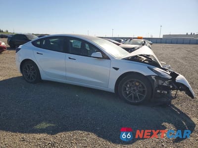 Czwarte zdjęcie samochodu z boku: 2022 TESLA MODEL 3 VIN:5YJ3E1EA6NF362039 - miniatura