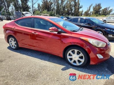Czwarte zdjęcie samochodu z boku: 2012 HYUNDAI ELANTRA LIMITED VIN:KMHDH4AE5CU479925 - miniatura