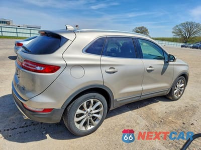 Trzecie zdjęcie samochodu z tyłu: 2015 LINCOLN MKC VIN:5LMCJ1A9XFUJ10142 - miniatura