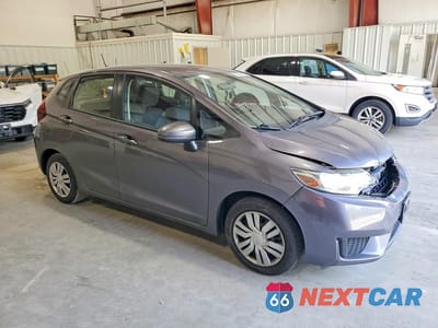 Czwarte zdjęcie samochodu z boku: 2016 HONDA FIT LX VIN:JHMGK5H56GX032277 - miniatura