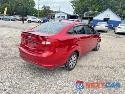 Czwarte zdjęcie samochodu z boku: 2011 FORD FIESTA SE VIN:3FADP4BJ6BM118621 - miniatura