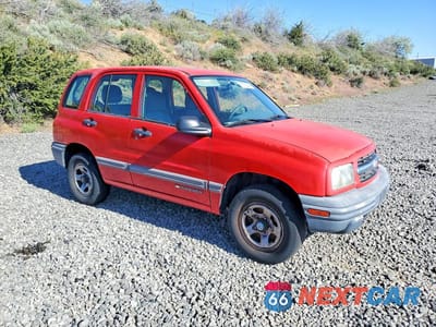 Czwarte zdjęcie samochodu z boku: 2001 CHEV TRACKER VIN:2CNBJ13C316901496 - miniatura