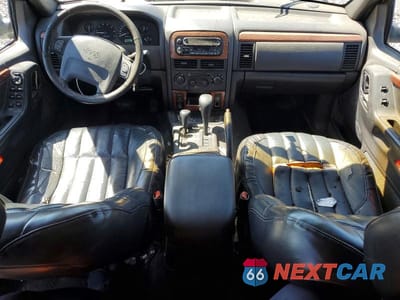 Zdjęcie 8 z 12 samochodu: 1999 JEEP GRAND CHEROKEE LIMITED VIN:1J4GW68N5XC638750 - miniatura