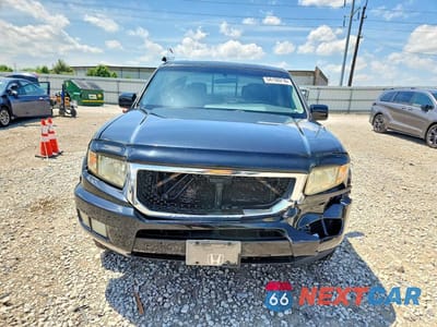 Piąte zdjęcie samochodu w środku: 2011 HONDA RIDGELINE RTL VIN:5FPYK1F5XBB001982 - miniatura