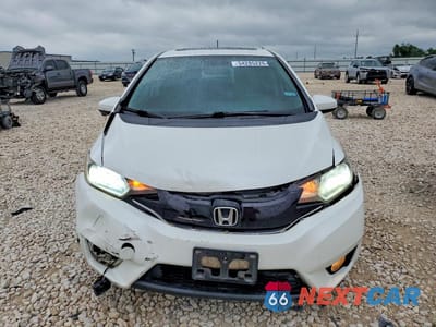 Piąte zdjęcie samochodu w środku: 2016 HONDA FIT EX VIN:JHMGK5H70GX041512 - miniatura