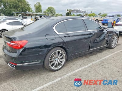 Trzecie zdjęcie samochodu z tyłu: 2016 BMW 740 I VIN:WBA7E2C52GG738741 - miniatura