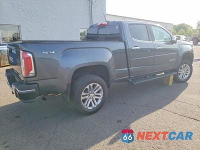 Trzecie zdjęcie samochodu z tyłu: 2016 GMC CANYON SLT VIN:1GTG6DE38G1335762 - miniatura