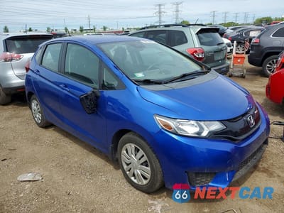 Czwarte zdjęcie samochodu z boku: 2015 HONDA FIT LX VIN:3HGGK5H56FM771804 - miniatura