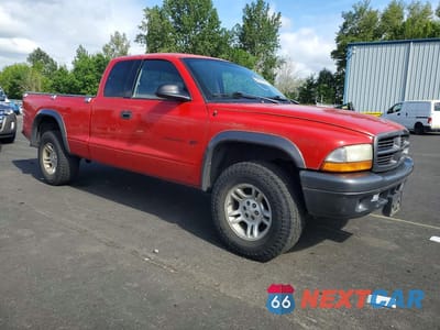 Czwarte zdjęcie samochodu z boku: 2002 DODGE DAKOTA BASE VIN:1B7GG12X02S721601 - miniatura