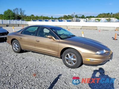 Czwarte zdjęcie samochodu z boku: 1998 OLDSMOBILE AURORA VIN:1G3GR62C5W4106251 - miniatura