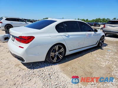 Trzecie zdjęcie samochodu z tyłu: 2018 BMW 750 I VIN:WBA7F0C58JGM23449 - miniatura