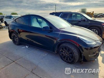 Czwarte zdjęcie samochodu z boku: 2022 TESLA MODEL Y VIN:7SAYGAEE7NF418611 - miniatura