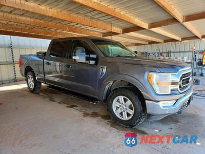 Czwarte zdjęcie samochodu z boku: 2022 FORD F150 SUPERCREW VIN:1FTFW1E51NKE65546 - miniatura