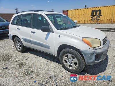 Czwarte zdjęcie samochodu z boku: 2001 TOYOTA RAV4 BASE VIN:JTEGH20V110040292 - miniatura