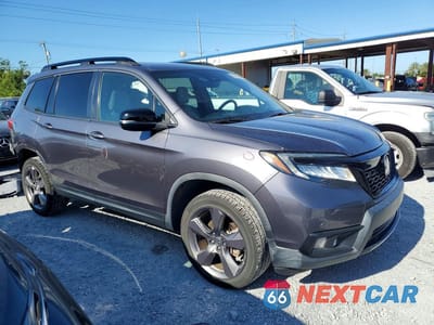 Czwarte zdjęcie samochodu z boku: 2021 HONDA PASSPORT TOURING VIN:5FNYF8H96MB015404 - miniatura