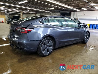 Trzecie zdjęcie samochodu z tyłu: 2023 TESLA MODEL 3 VIN:5YJ3E1EA0PF457862 - miniatura