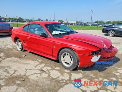 Czwarte zdjęcie samochodu z boku: 1997 FORD MUSTANG VIN:1FALP4044VF158550 - miniatura