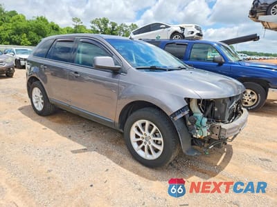 Czwarte zdjęcie samochodu z boku: 2010 FORD EDGE SEL VIN:2FMDK3JC9ABA11550 - miniatura