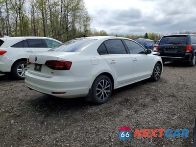 Trzecie zdjęcie samochodu z tyłu: 2016 VOLKSWAGEN JETTA SE VIN:3VWD67AJ9GM302424 - miniatura