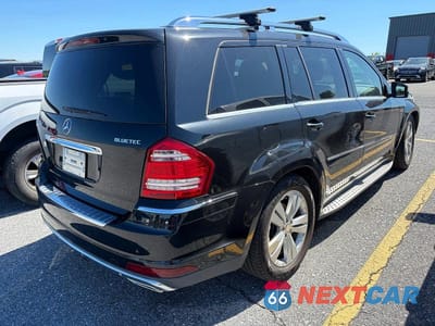 Czwarte zdjęcie samochodu z boku: 2011 MERCEDES-BENZ GL 350 BLUETEC VIN:4JGBF2FE0BA760699 - miniatura