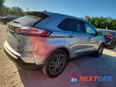 Trzecie zdjęcie samochodu z tyłu: 2020 FORD EDGE TITANIUM VIN:2FMPK4K95LBB31449 - miniatura