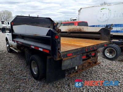 Trzecie zdjęcie samochodu z tyłu: 1999 FORD F350 SUPER DUTY DUMP TRUCK VIN:1FDWF37FXXEC62430 - miniatura