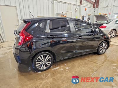 Trzecie zdjęcie samochodu z tyłu: 2016 HONDA FIT EX VIN:JHMGK5H71GX046010 - miniatura