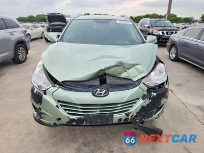 Piąte zdjęcie samochodu w środku: 2011 HYUNDAI TUCSON GLS VIN:KM8JU3AC7BU125930 - miniatura
