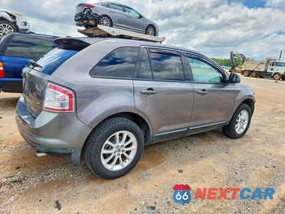 Trzecie zdjęcie samochodu z tyłu: 2010 FORD EDGE SEL VIN:2FMDK3JC9ABA11550 - miniatura