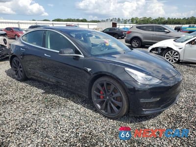 Czwarte zdjęcie samochodu z boku: 2020 TESLA MODEL 3 VIN:5YJ3E1EC0LF796181 - miniatura