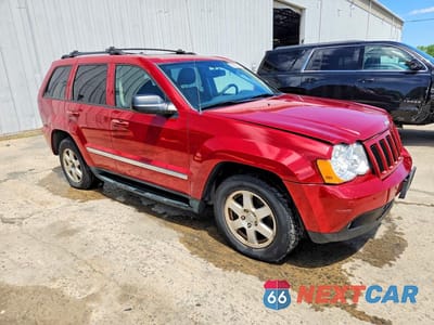 Czwarte zdjęcie samochodu z boku: 2010 JEEP GRAND CHEROKEE LAREDO VIN:1J4PR4GK8AC107634 - miniatura