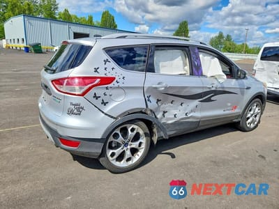 Trzecie zdjęcie samochodu z tyłu: 2016 FORD ESCAPE TITANIUM VIN:1FMCU0J99GUA04139 - miniatura