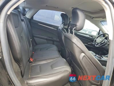 Zdjęcie 10 z 13 samochodu: 2013 FORD FUSION TITANIUM PHEV VIN:3FA6P0SU8DR365799 - miniatura