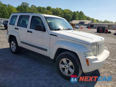 Czwarte zdjęcie samochodu z boku: 2010 JEEP LIBERTY SPORT VIN:1J4PN2GK5AW133025 - miniatura