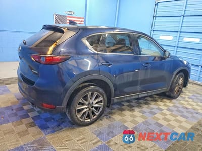 Trzecie zdjęcie samochodu z tyłu: 2021 MAZDA CX-5 GRAND TOURING VIN:JM3KFADM6M0333973 - miniatura