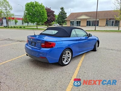 Czwarte zdjęcie samochodu z boku: 2015 BMW 228 XI VIN:WBA1K7C50FV235358 - miniatura
