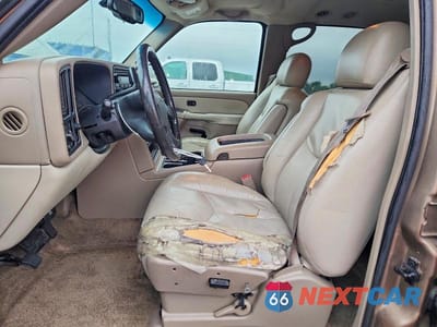 Zdjęcie 7 z 13 samochodu: 2003 GMC YUKON XL C1500 VIN:1GKEC16Z53J172987 - miniatura