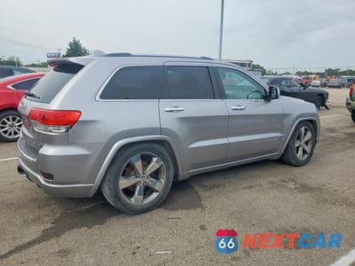 Trzecie zdjęcie samochodu z tyłu: 2014 JEEP GRAND CHEROKEE OVERLAND VIN:1C4RJFCG7EC523022 - miniatura